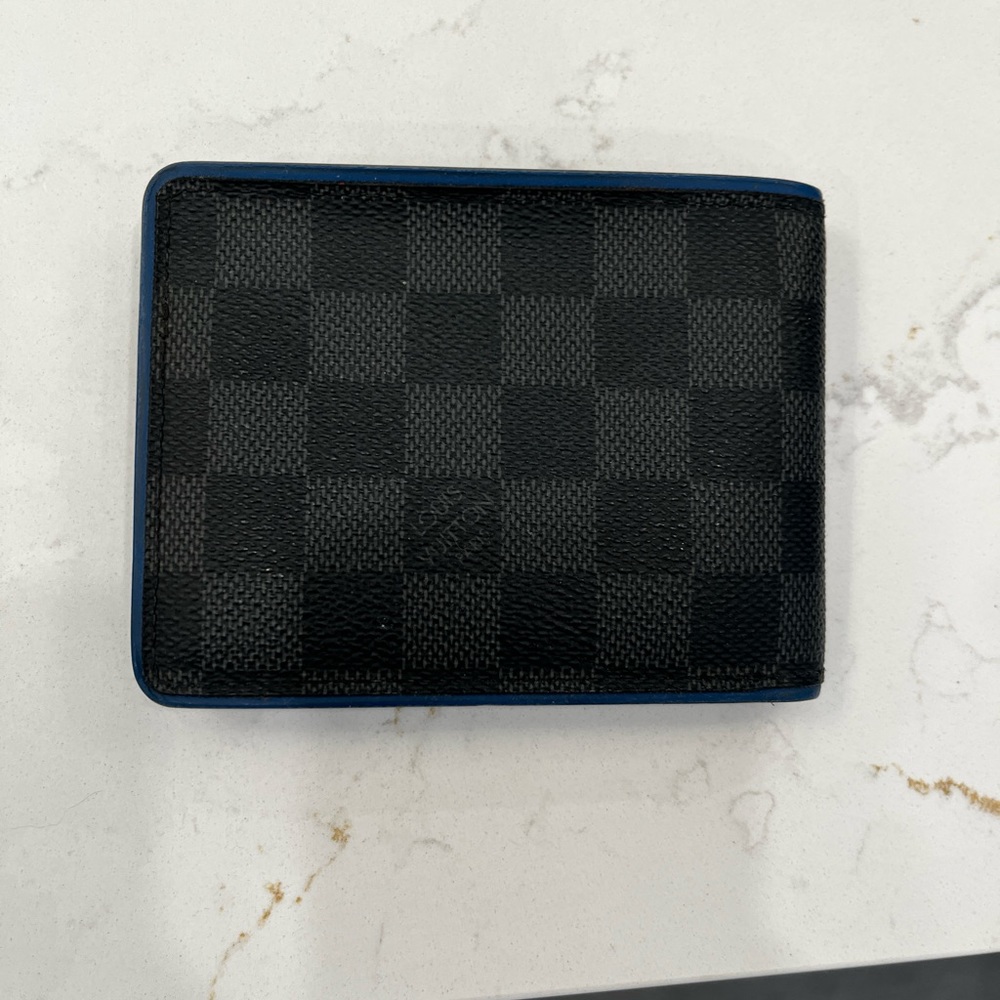 Authentic Louis Vuitton men’s wallet. Limited edition blue no longer available.
